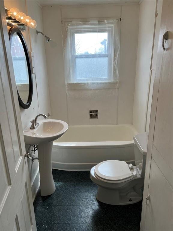 bathroom featuring toilet and bathtub / shower combination