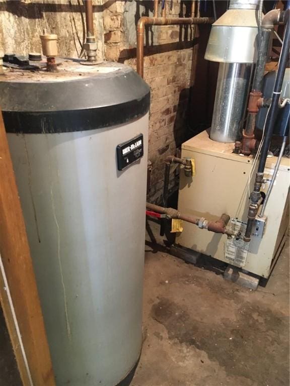 utility room with gas water heater and heating unit