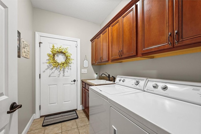 707 W Coolidge Ave, Charleston, IL 61920 - laundry area with washing machine and dryer, cabinet space, and light tile patterned floors