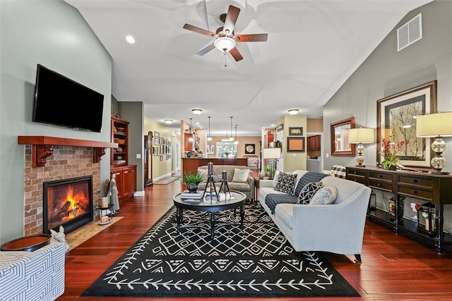 707 W Coolidge Ave, Charleston, IL 61920 - living area featuring a ceiling fan, wood finished floors, a brick fireplace, vaulted ceiling, and recessed lighting
