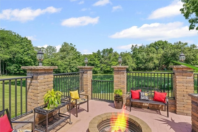 707 W Coolidge Ave, Charleston, IL 61920 - view of patio featuring a fire pit and view of scattered trees
