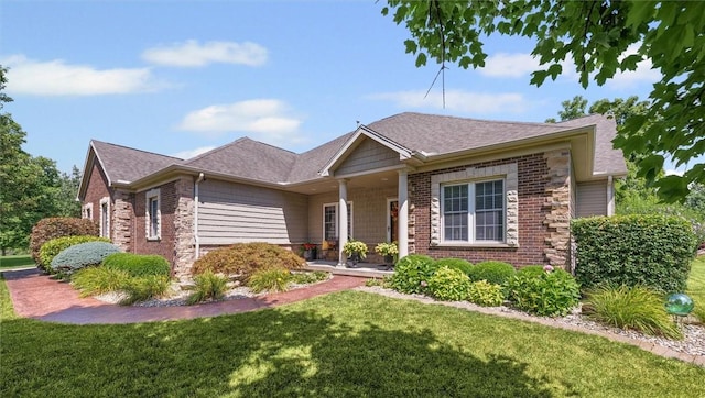 707 W Coolidge Ave, Charleston, IL 61920 - ranch-style house with a front lawn, covered porch, roof with shingles, and brick siding