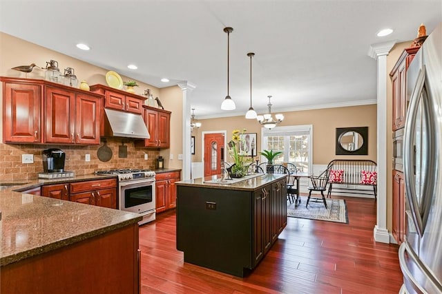 707 W Coolidge Ave, Charleston, IL 61920 - kitchen featuring appliances with stainless steel finishes, under cabinet range hood, ornamental molding, tasteful backsplash, and pendant lighting