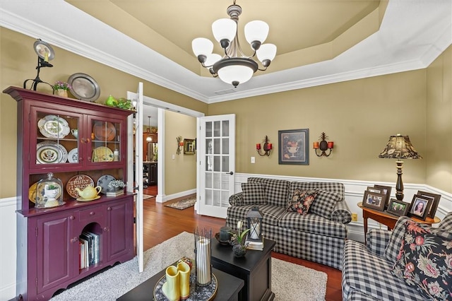 707 W Coolidge Ave, Charleston, IL 61920 - living room featuring a chandelier, french doors, wood finished floors, ornamental molding, and a tray ceiling