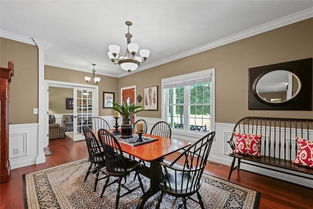 707 W Coolidge Ave, Charleston, IL 61920 - dining room with a chandelier, wood finished floors, a wainscoted wall, and crown molding