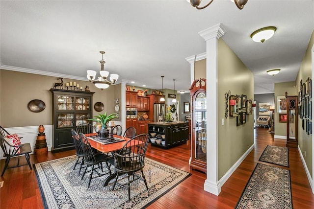 707 W Coolidge Ave, Charleston, IL 61920 - dining area featuring a chandelier, dark wood finished floors, decorative columns, and ornamental molding