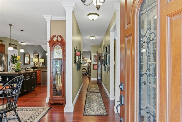 707 W Coolidge Ave, Charleston, IL 61920 - entryway with dark wood-type flooring and decorative columns