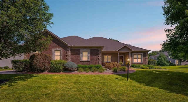 707 W Coolidge Ave, Charleston, IL 61920 - ranch-style house with a front lawn and brick siding