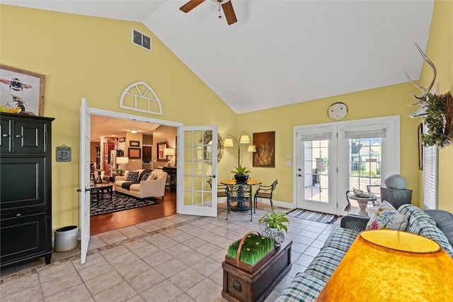 707 W Coolidge Ave, Charleston, IL 61920 - living area with french doors, a ceiling fan, light tile patterned floors, and high vaulted ceiling