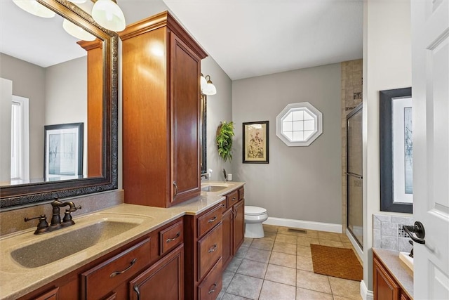 707 W Coolidge Ave, Charleston, IL 61920 - full bathroom featuring a stall shower, double vanity, and tile patterned floors