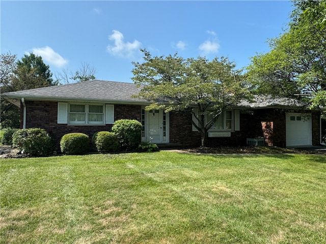 single story home featuring a front lawn and a garage