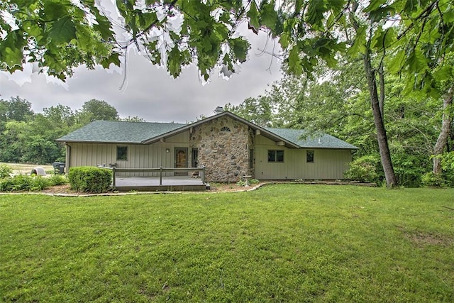 5959 Heritage Ln, Oakley, IL 62501 - back of house featuring a yard and stone siding