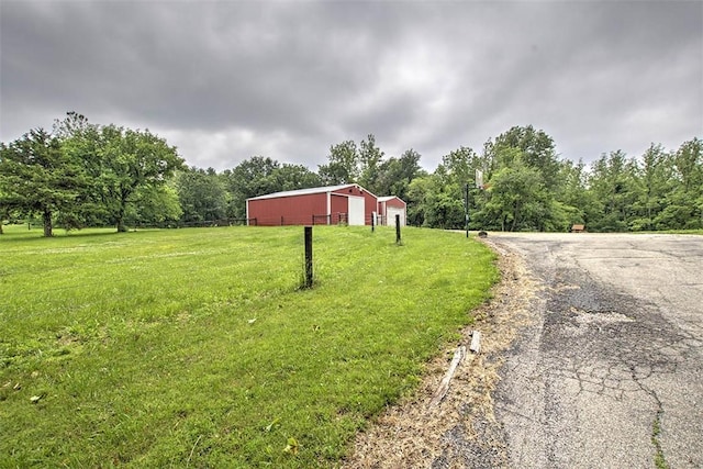 5959 Heritage Ln, Oakley, IL 62501 - view of road featuring an outbuilding and a forest view