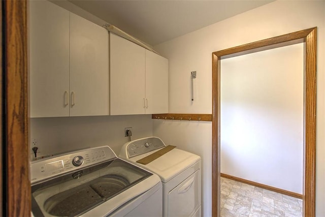 5959 Heritage Ln, Oakley, IL 62501 - laundry room with cabinet space, independent washer and dryer, and baseboards