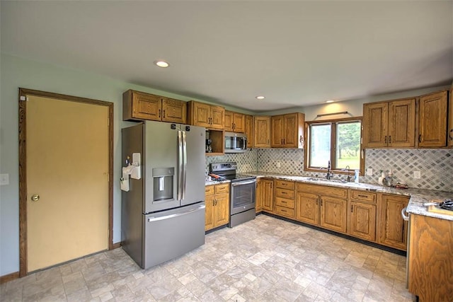 5959 Heritage Ln, Oakley, IL 62501 - kitchen with appliances with stainless steel finishes, a sink, brown cabinetry, backsplash, and recessed lighting