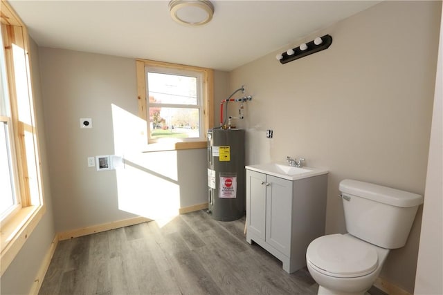 2805 Commercial Ave, Mattoon, IL 61938 - bathroom with electric water heater, vanity, and wood finished floors