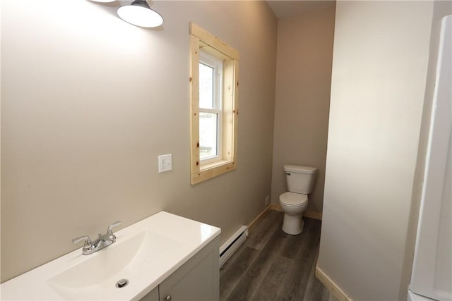 2805 Commercial Ave, Mattoon, IL 61938 - half bath with baseboard heating, wood finished floors, and vanity
