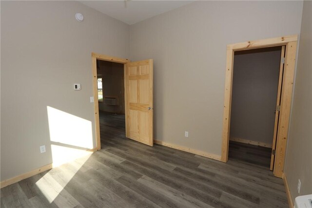 2805 Commercial Ave, Mattoon, IL 61938 - unfurnished room with dark wood-style flooring