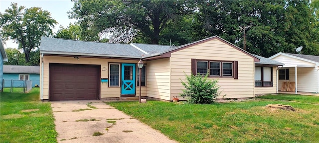 single story home featuring a front yard and a garage