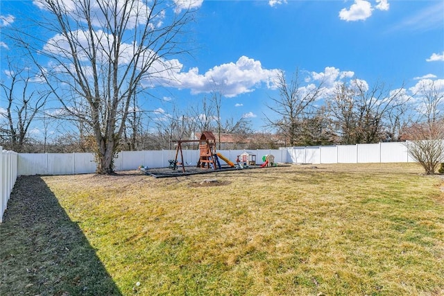 view of yard featuring a fenced backyard and a playground