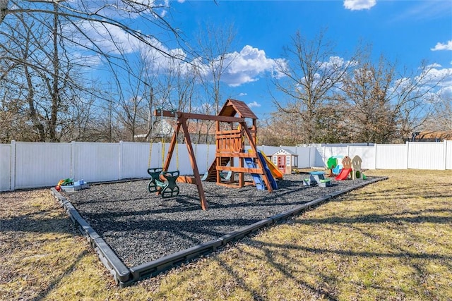 view of playground featuring a yard and a fenced backyard