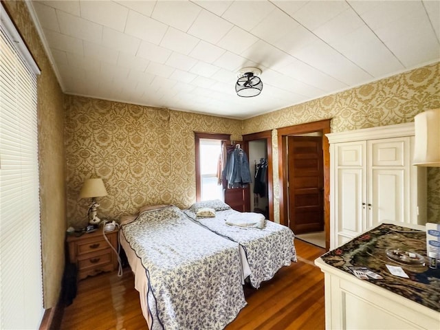 1625 Archer Ave, Marshall, IL 62441 - bedroom with wallpapered walls and dark wood-style floors