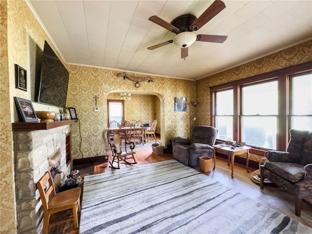 1625 Archer Ave, Marshall, IL 62441 - living area with arched walkways, wallpapered walls, wood finished floors, and a wealth of natural light