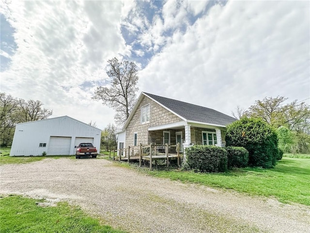 1625 Archer Ave, Marshall, IL 62441 - view of side of property with a yard, an outbuilding, stone siding, and a detached garage