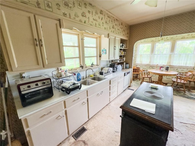 1625 Archer Ave, Marshall, IL 62441 - kitchen with visible vents, light countertops, a sink, and wallpapered walls