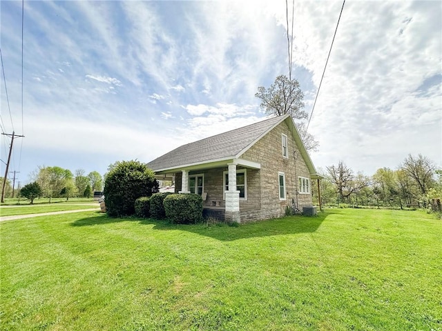 1625 Archer Ave, Marshall, IL 62441 - view of side of home featuring a yard, central AC, and stone siding