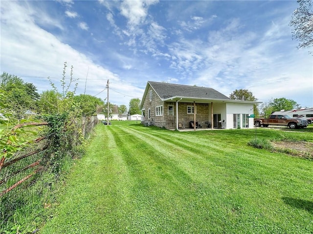 1625 Archer Ave, Marshall, IL 62441 - rear view of house with a lawn, fence, and a patio area