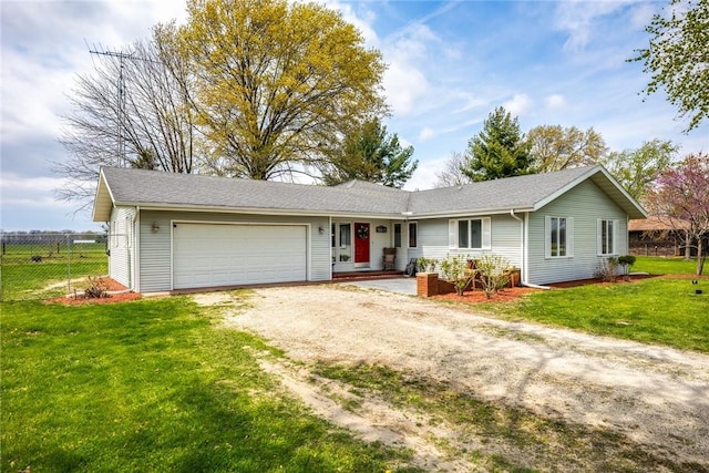 ranch-style home featuring fence, an attached garage, driveway, and a front yard