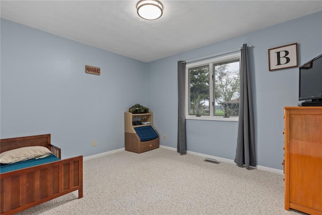carpeted bedroom with baseboards and visible vents
