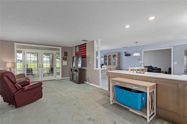 living area with light colored carpet, french doors, recessed lighting, baseboards, and visible vents