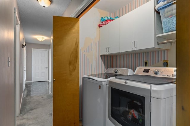 laundry room with carpet, cabinet space, and independent washer and dryer
