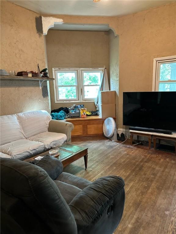 202 S College St, Blue Mound, IL 62513 - living room featuring a textured wall and wood finished floors