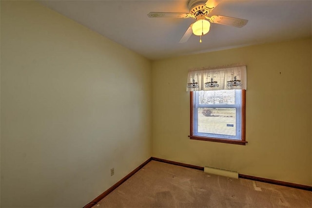 empty room featuring light colored carpet and ceiling fan