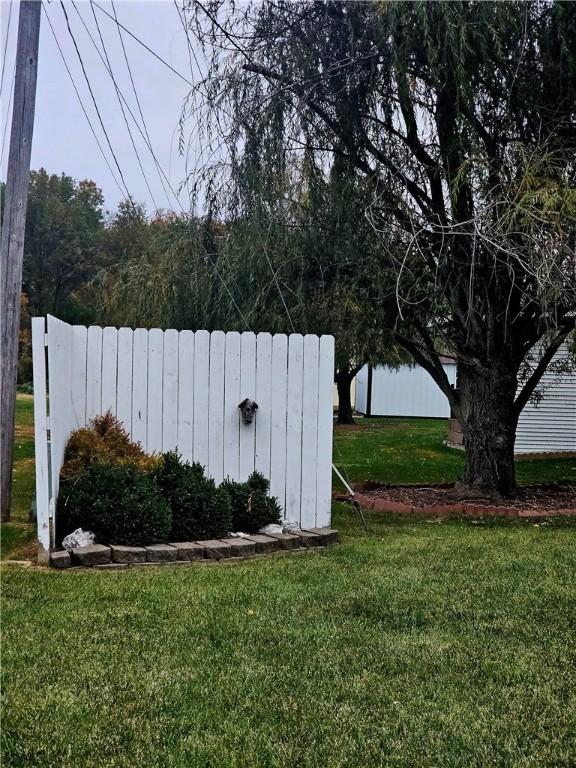 view of yard featuring radiator and fence