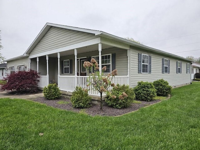 view of front facade with a porch and a front lawn