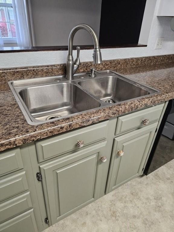 room details with dark countertops and a sink