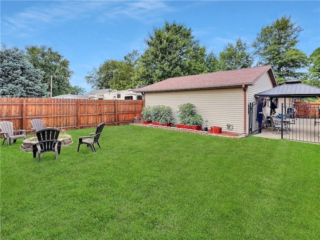 2321 Shelby Ave, Mattoon, IL 61938 - view of yard featuring a gazebo, a patio, and an outdoor fire pit