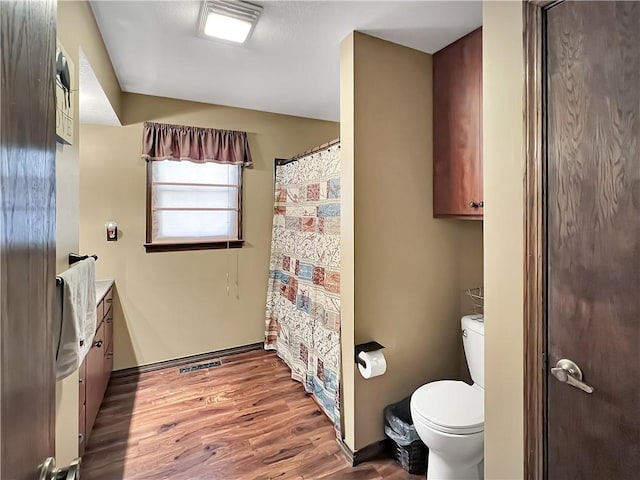 2321 Shelby Ave, Mattoon, IL 61938 - full bathroom with vanity, wood finished floors, and a shower with curtain