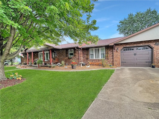2321 Shelby Ave, Mattoon, IL 61938 - single story home with driveway, a front yard, a garage, and brick siding