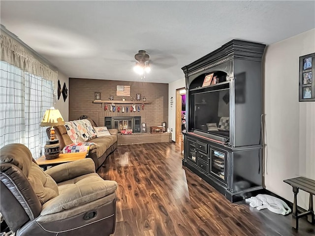 2321 Shelby Ave, Mattoon, IL 61938 - living area featuring ceiling fan, dark wood-type flooring, and a brick fireplace