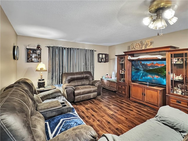 2321 Shelby Ave, Mattoon, IL 61938 - living area with dark wood-type flooring, a ceiling fan, and a textured ceiling