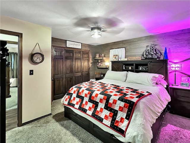 2321 Shelby Ave, Mattoon, IL 61938 - bedroom featuring carpet floors, a closet, ceiling fan, and wooden walls