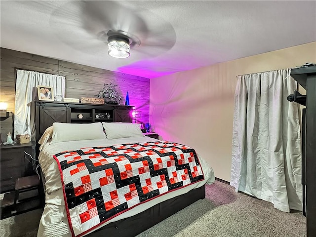 2321 Shelby Ave, Mattoon, IL 61938 - carpeted bedroom featuring ceiling fan and wooden walls