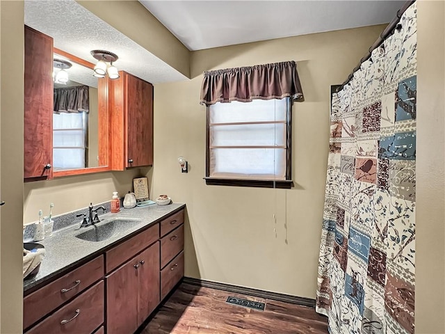2321 Shelby Ave, Mattoon, IL 61938 - bathroom with vanity and wood finished floors