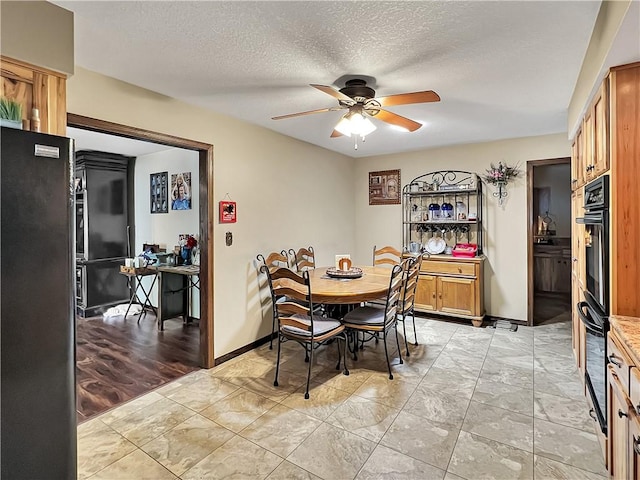 2321 Shelby Ave, Mattoon, IL 61938 - dining space featuring a ceiling fan, light marble finish flooring, and a textured ceiling
