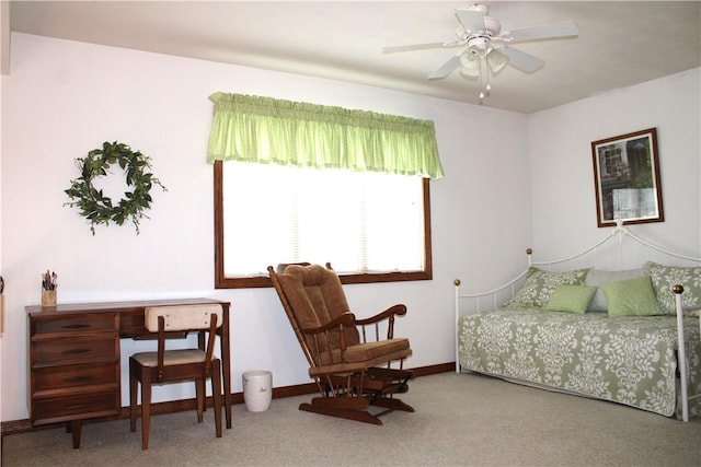carpeted bedroom featuring baseboards